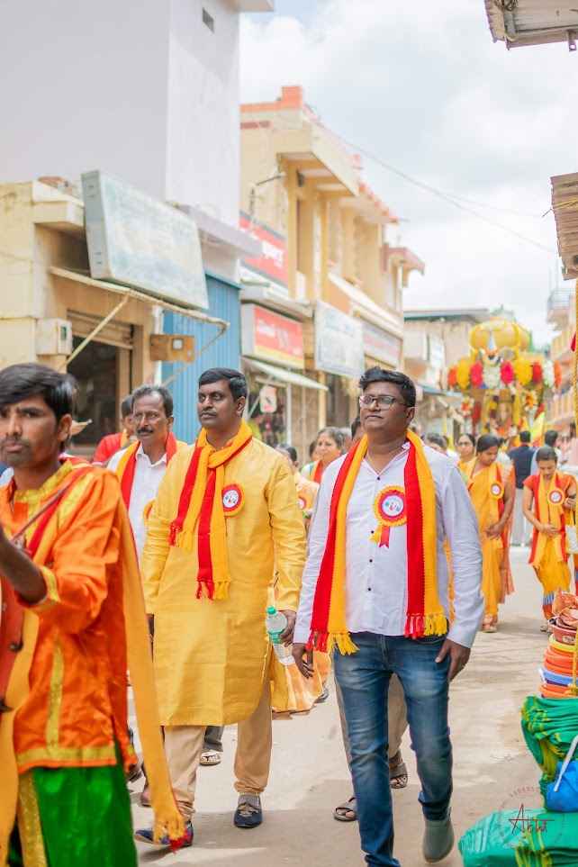 Community members walking the streets during the Rajyotsava 2023 procession