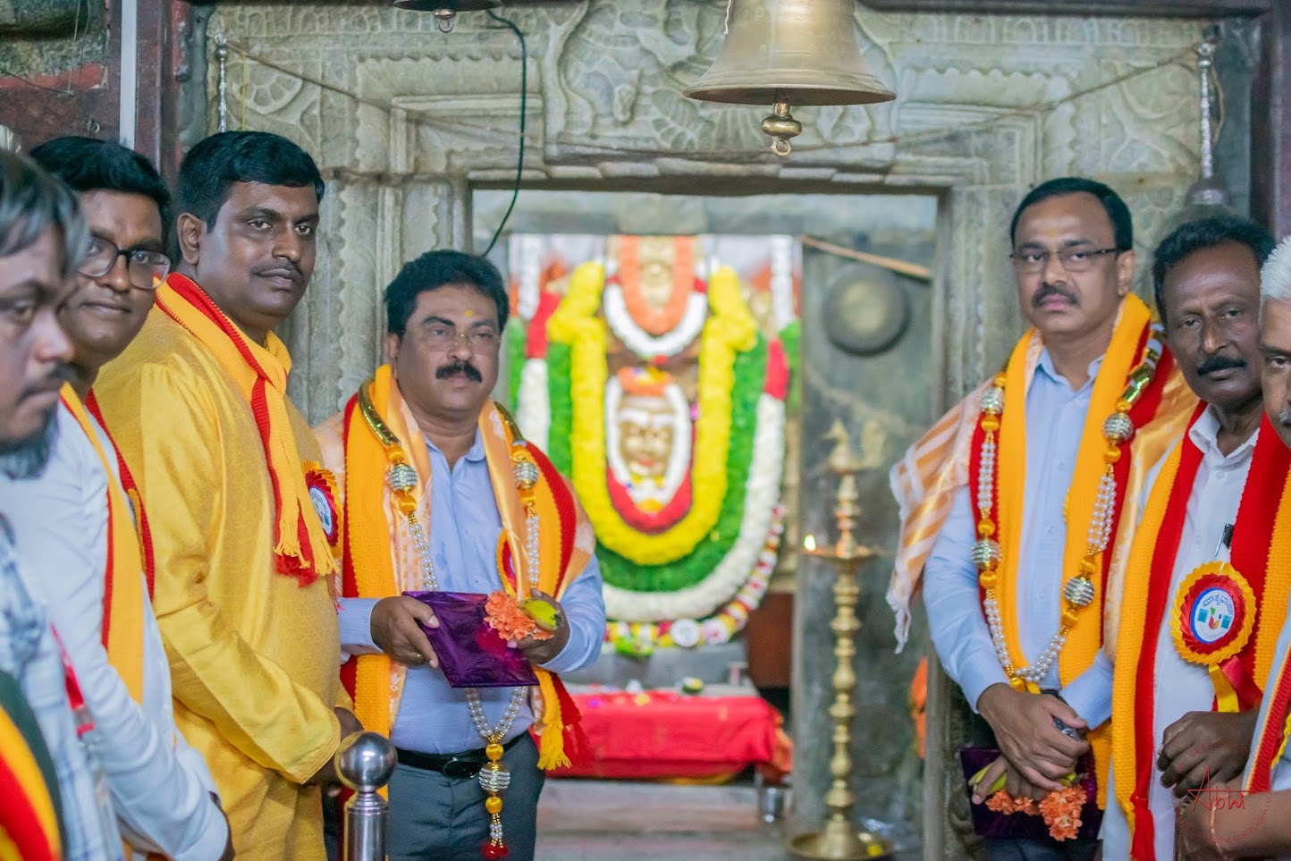 Community members on temple steps at the start of the Rajyotsava 2023 program